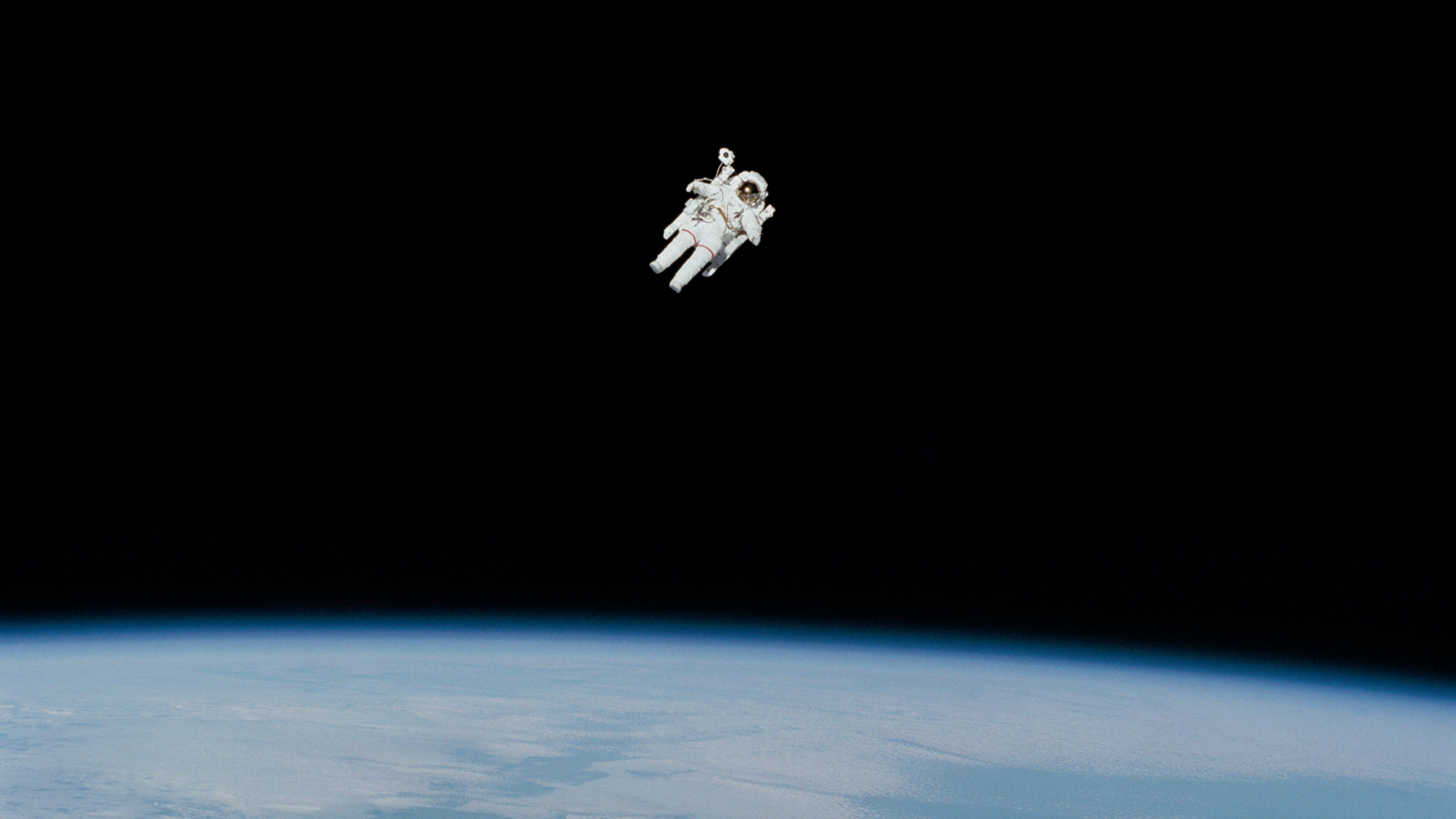 astronaut soaring through outer space